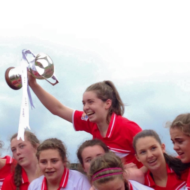 Grace Culloty raising the Minor Ladies All Ireland Football Cup